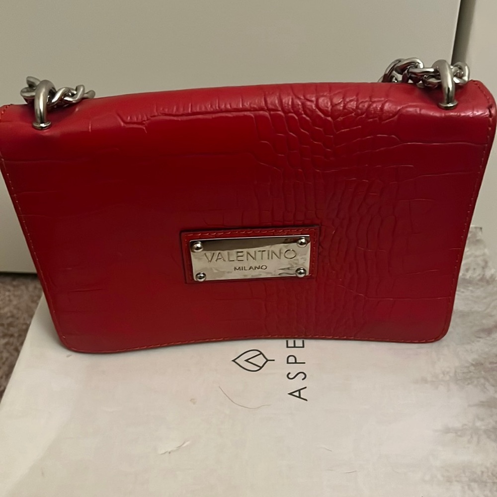 Authentic Valentino red hang bag one missing snap on left side can be replaced